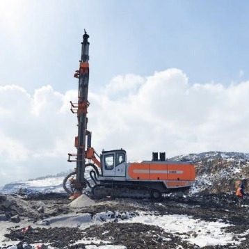 Búa khai thác tích hợp xuống máy khoan lỗ để khai thác đá và khai thác mỏ